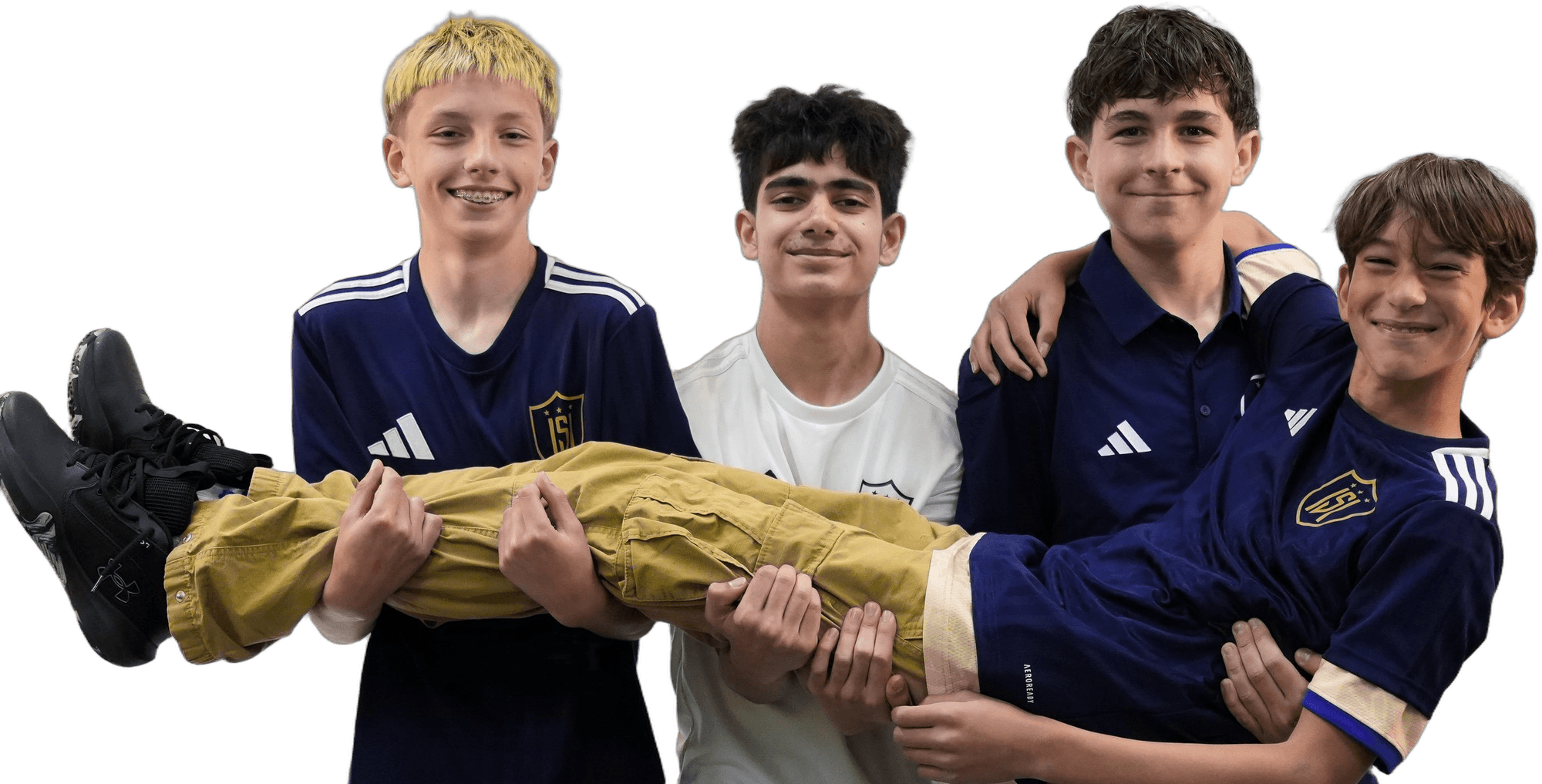 Four ISI Academy players grinning at the camera as three of them carry the fourth across their arms.