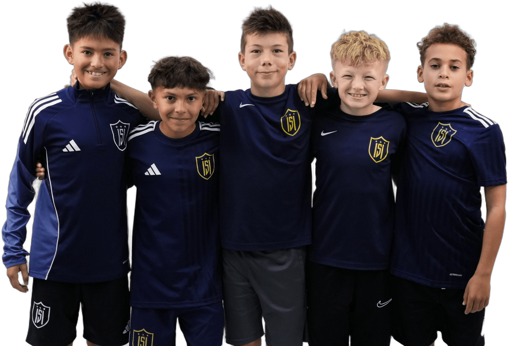 Five young ISI Academy players in navy kit, arms around each other, smiling.